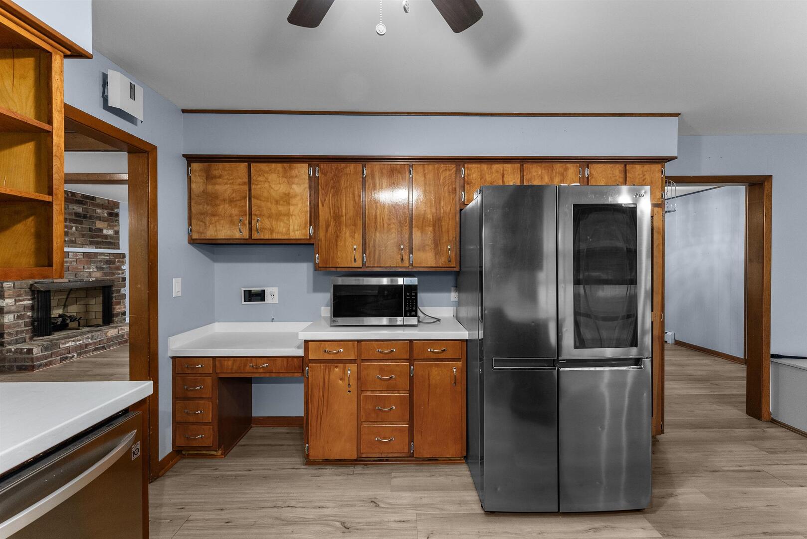 305 North Henderson Road Alexis, IL 61412 - Photo 16 of 31 a kitchen with stainless steel appliances granite countertop a refrigerator a sink and a stove