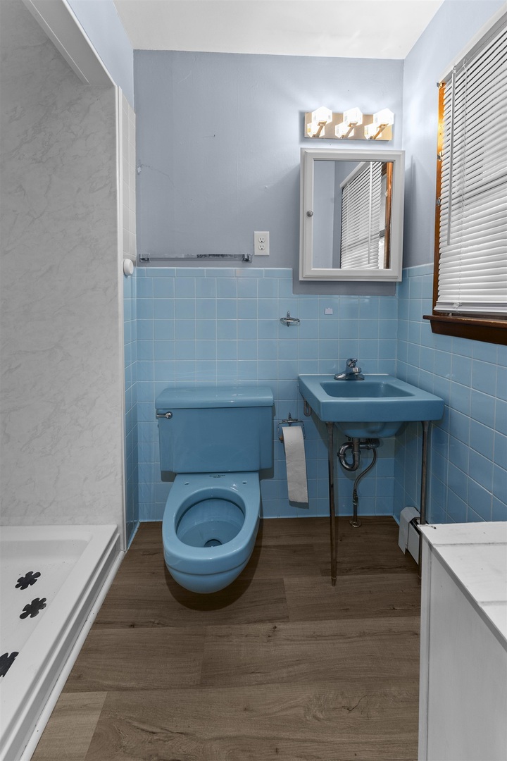 305 North Henderson Road Alexis, IL 61412 - Photo 23 of 31 a bathroom with a sink a toilet and mirror