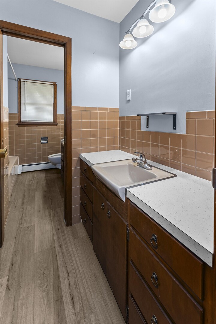 305 North Henderson Road Alexis, IL 61412 - Photo 24 of 31 a spacious bathroom with a sink a large mirror and vanity