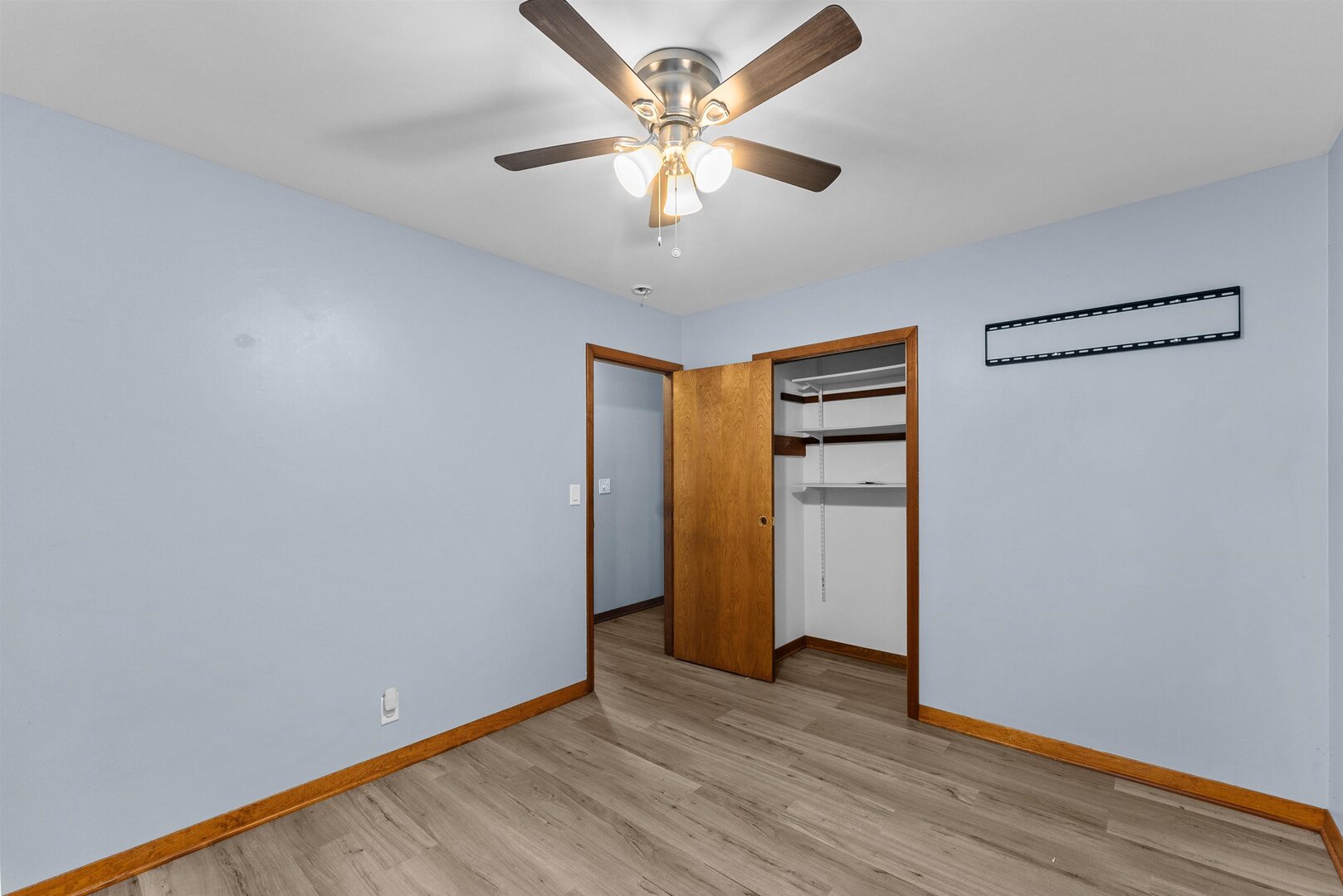 305 North Henderson Road Alexis, IL 61412 - Photo 27 of 31 a view of an empty room with closet and wooden floor