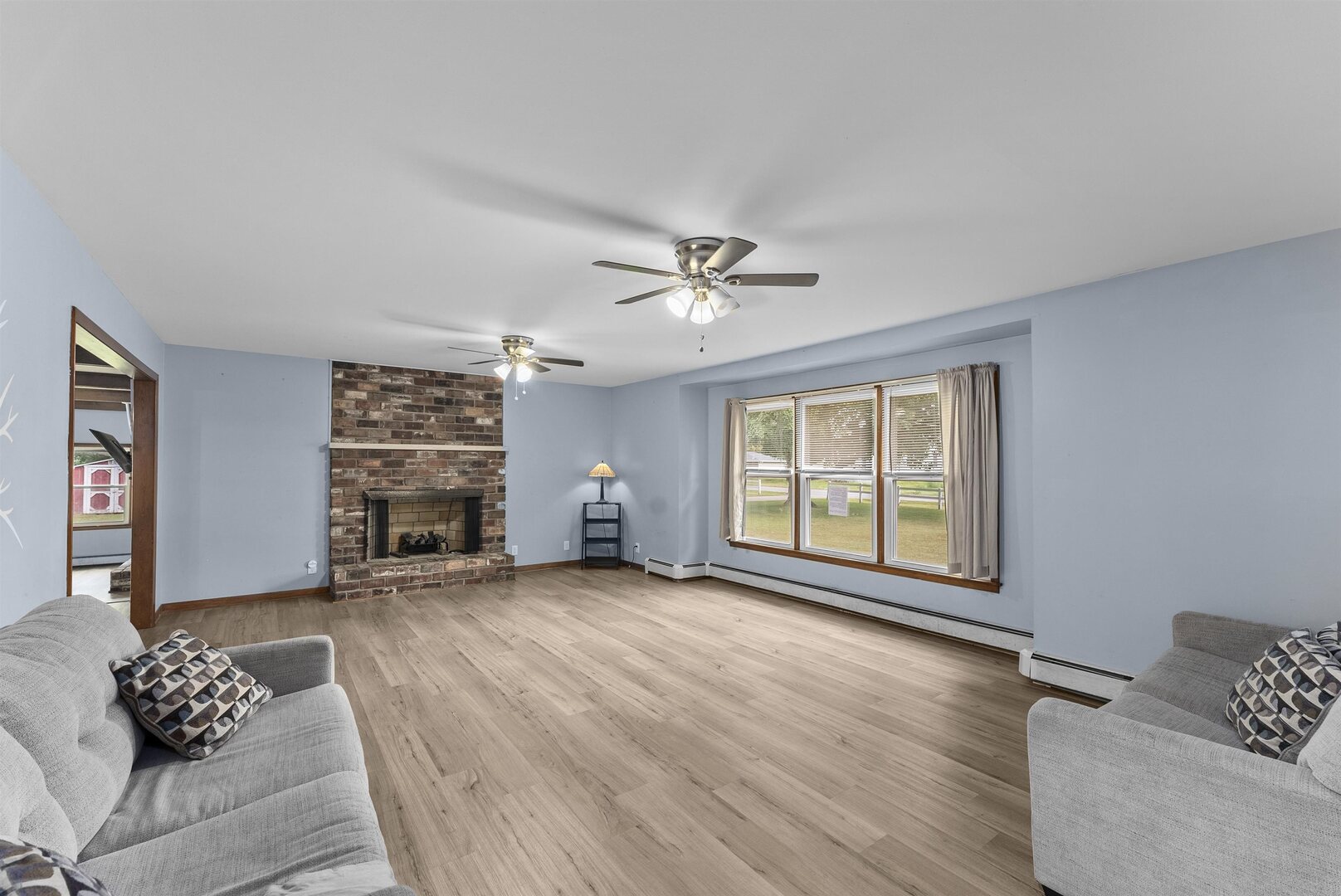 305 North Henderson Road Alexis, IL 61412 - Photo 8 of 31 a view of livingroom with hardwood floor and window