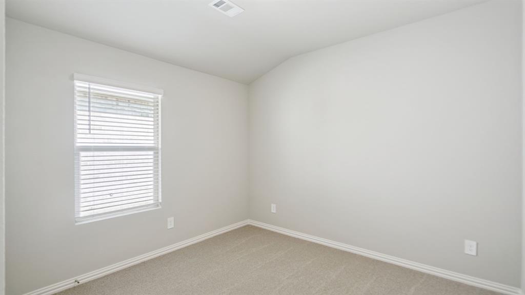 2215 Currents Road Princeton, TX 75407 - Photo 19 of 37 an empty room with a window