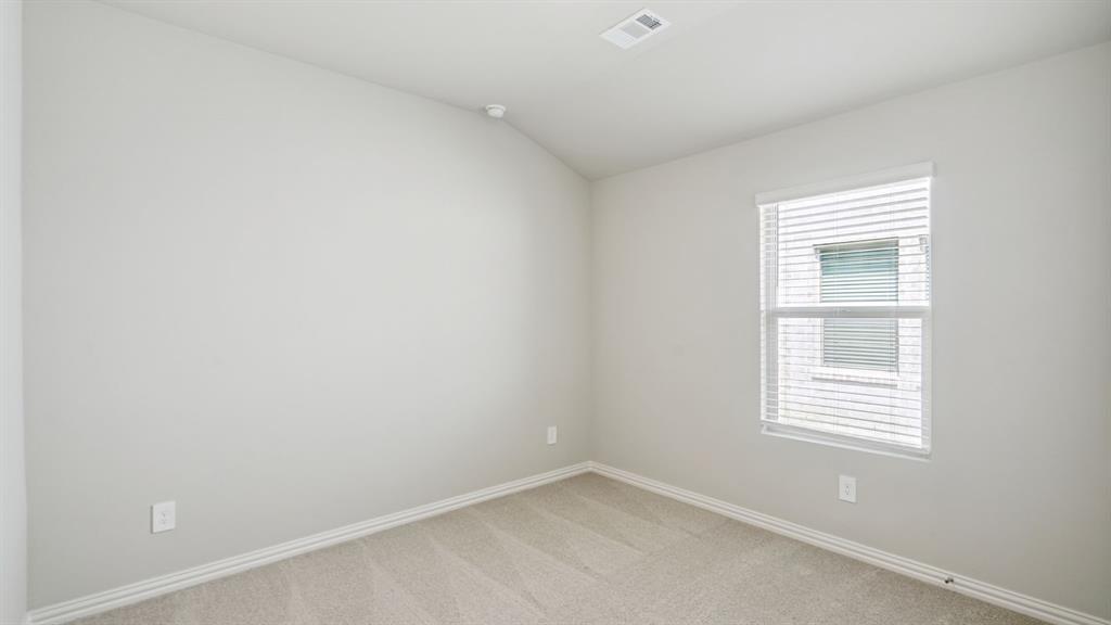 2215 Currents Road Princeton, TX 75407 - Photo 21 of 37 an empty room with a window