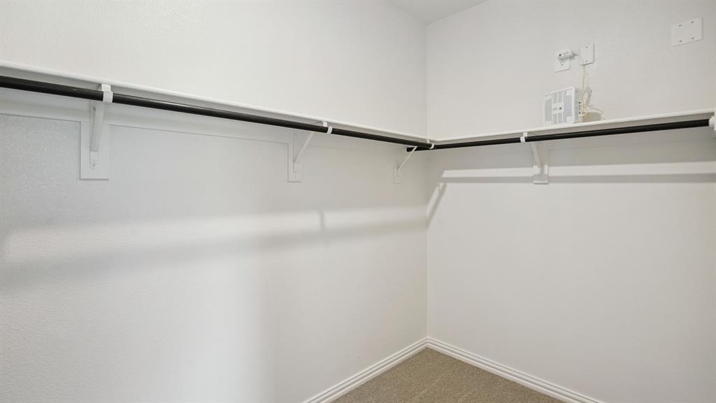 2215 Currents Road Princeton, TX 75407 - Photo 25 of 37 a view of small space with racks on the wall