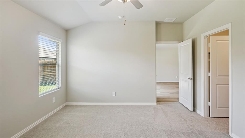 2215 Currents Road Princeton, TX 75407 - Photo 26 of 37 an empty room with windows and closet