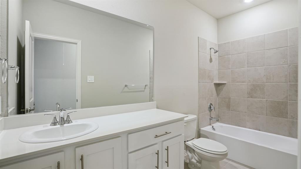 2215 Currents Road Princeton, TX 75407 - Photo 29 of 37 a bathroom with a sink a toilet and bathtub