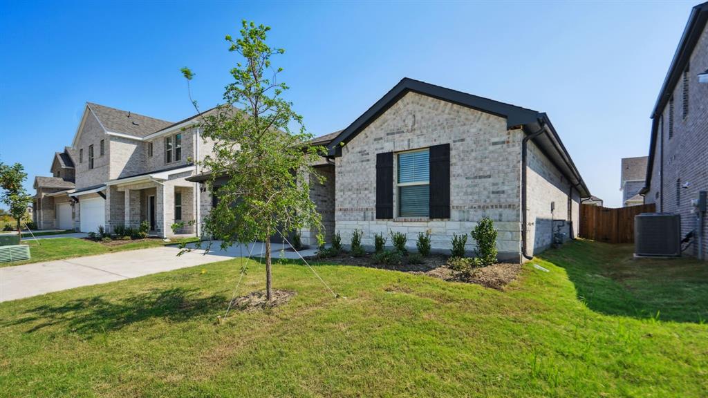 2215 Currents Road Princeton, TX 75407 - Photo 3 of 37 a front view of a house with a yard