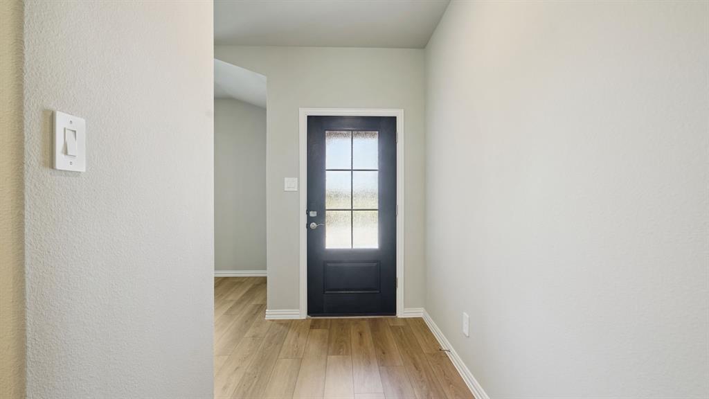 2215 Currents Road Princeton, TX 75407 - Photo 5 of 37 a view of empty room with wooden floor