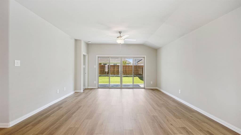 2215 Currents Road Princeton, TX 75407 - Photo 7 of 37 a view of an empty room with a window