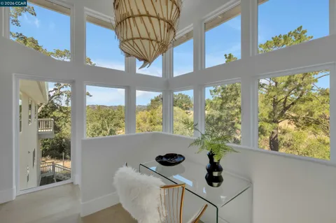 a bedroom with a bed and a lamp