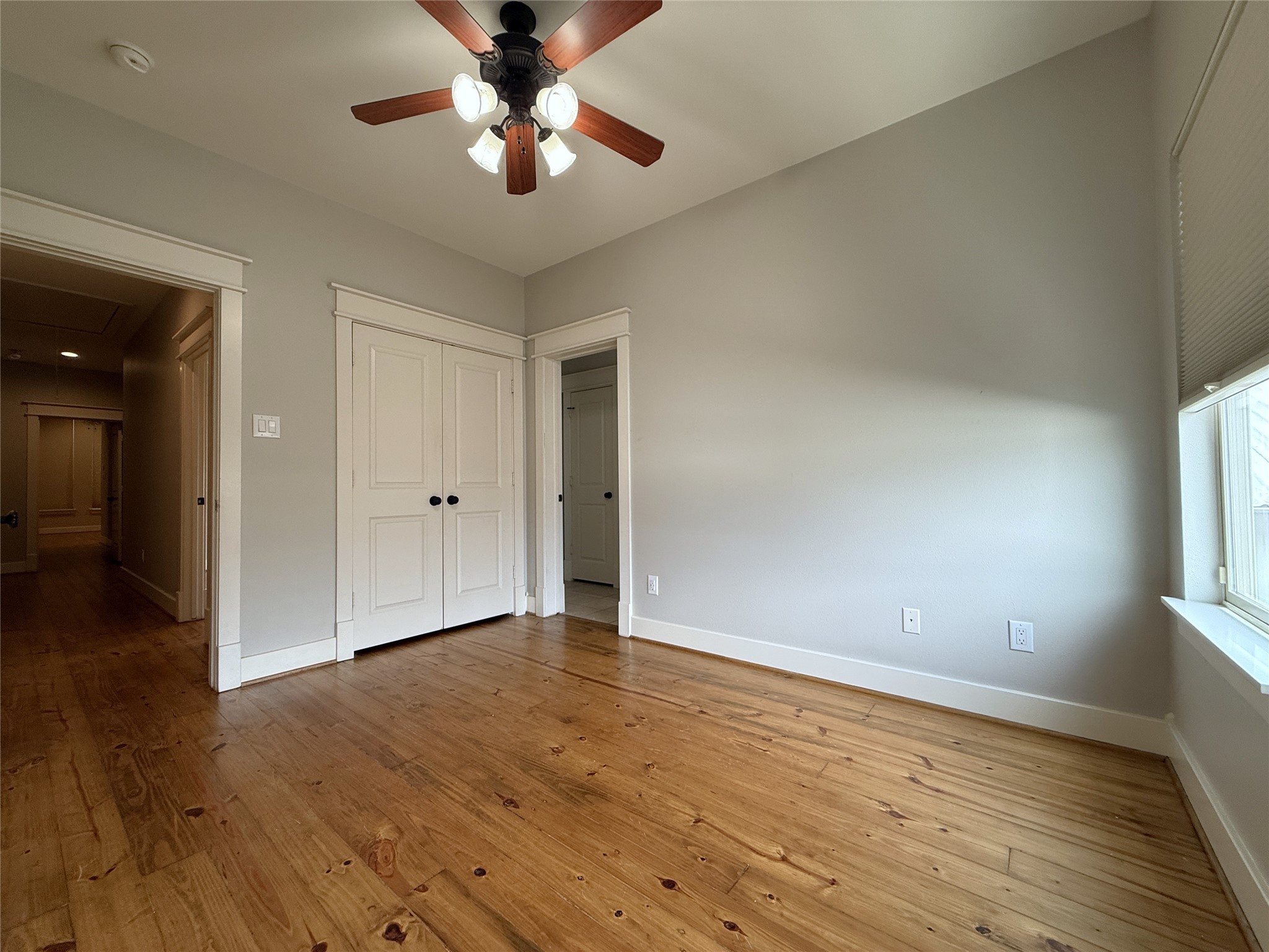 5237 Center Street Houston, TX 77007 - Photo 11 of 27 wooden floor in an empty room with a window