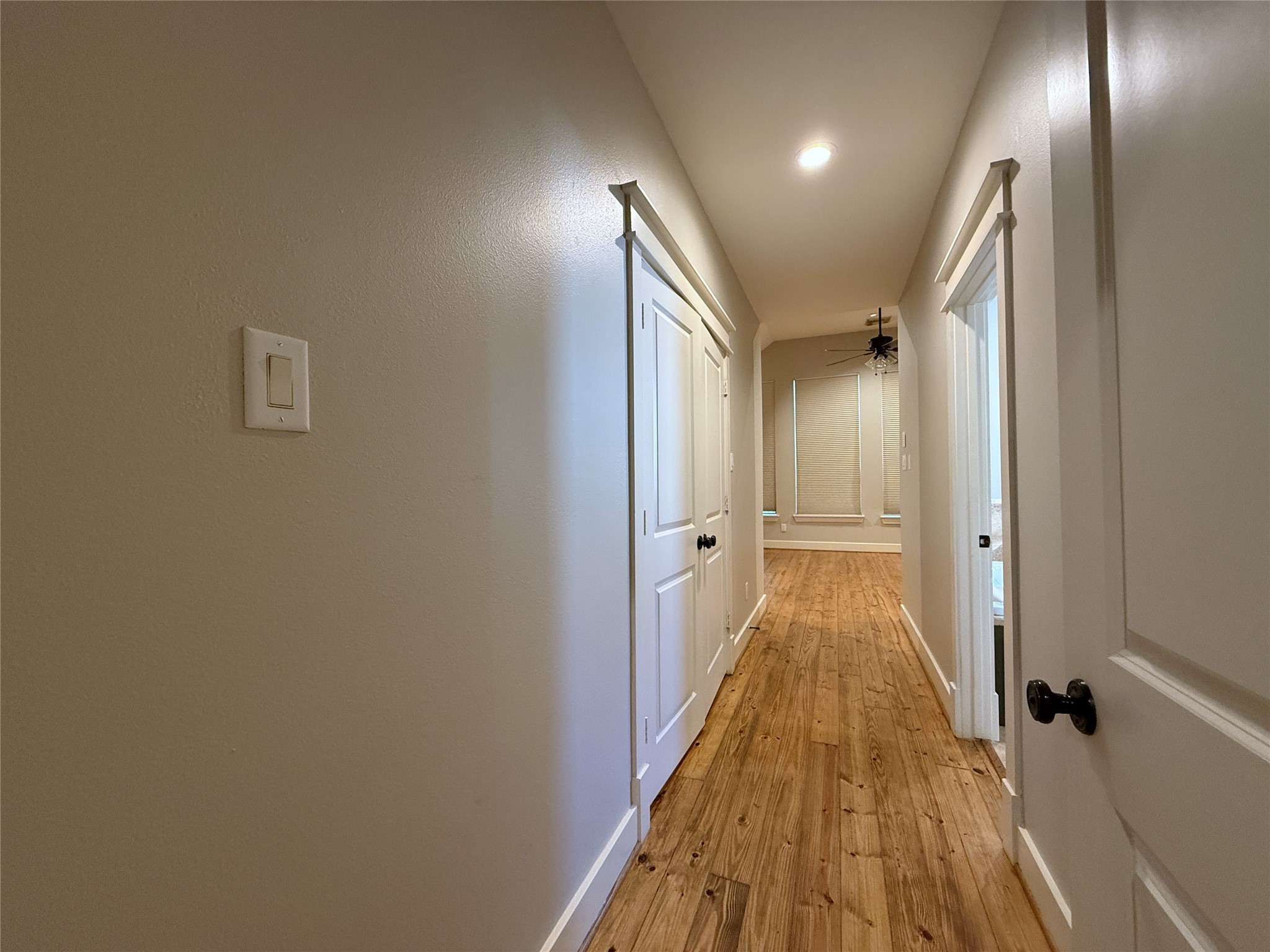 5237 Center Street Houston, TX 77007 - Photo 19 of 27 a view of a hallway with wooden floor and a bathroom