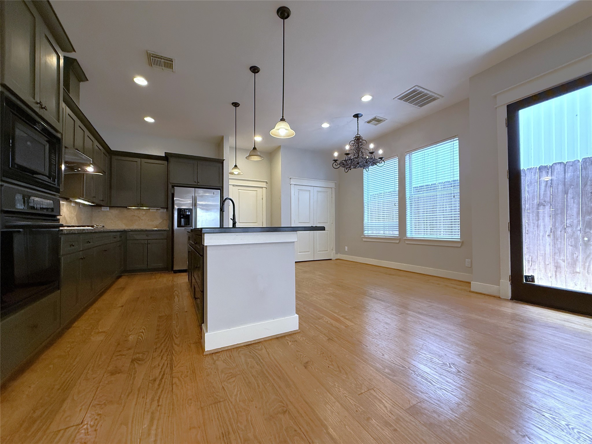 5237 Center Street Houston, TX 77007 - Photo 2 of 27 a view of a kitchen with cabinets and wooden floor