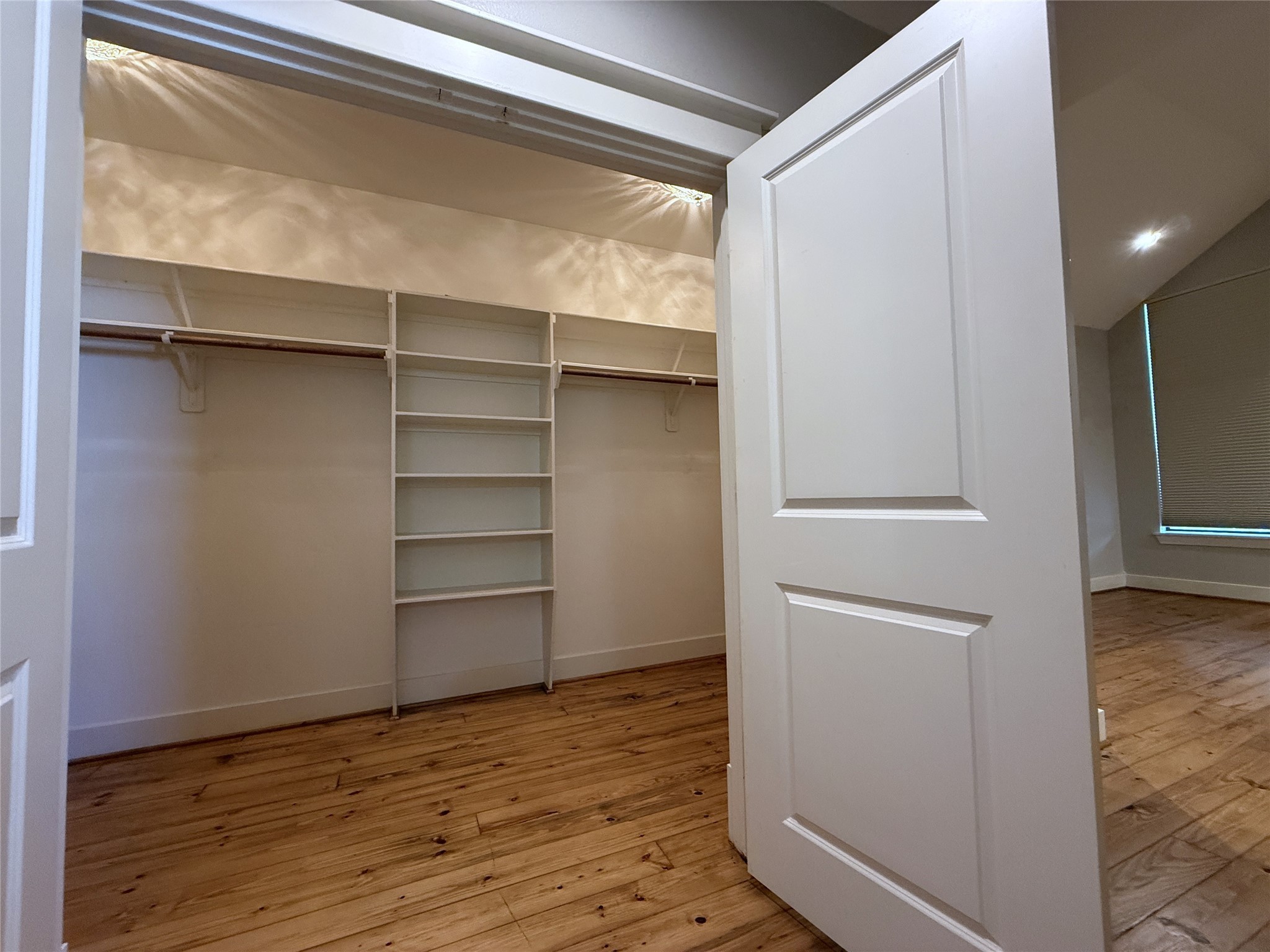 5237 Center Street Houston, TX 77007 - Photo 20 of 27 a view of walk in closet with empty racks