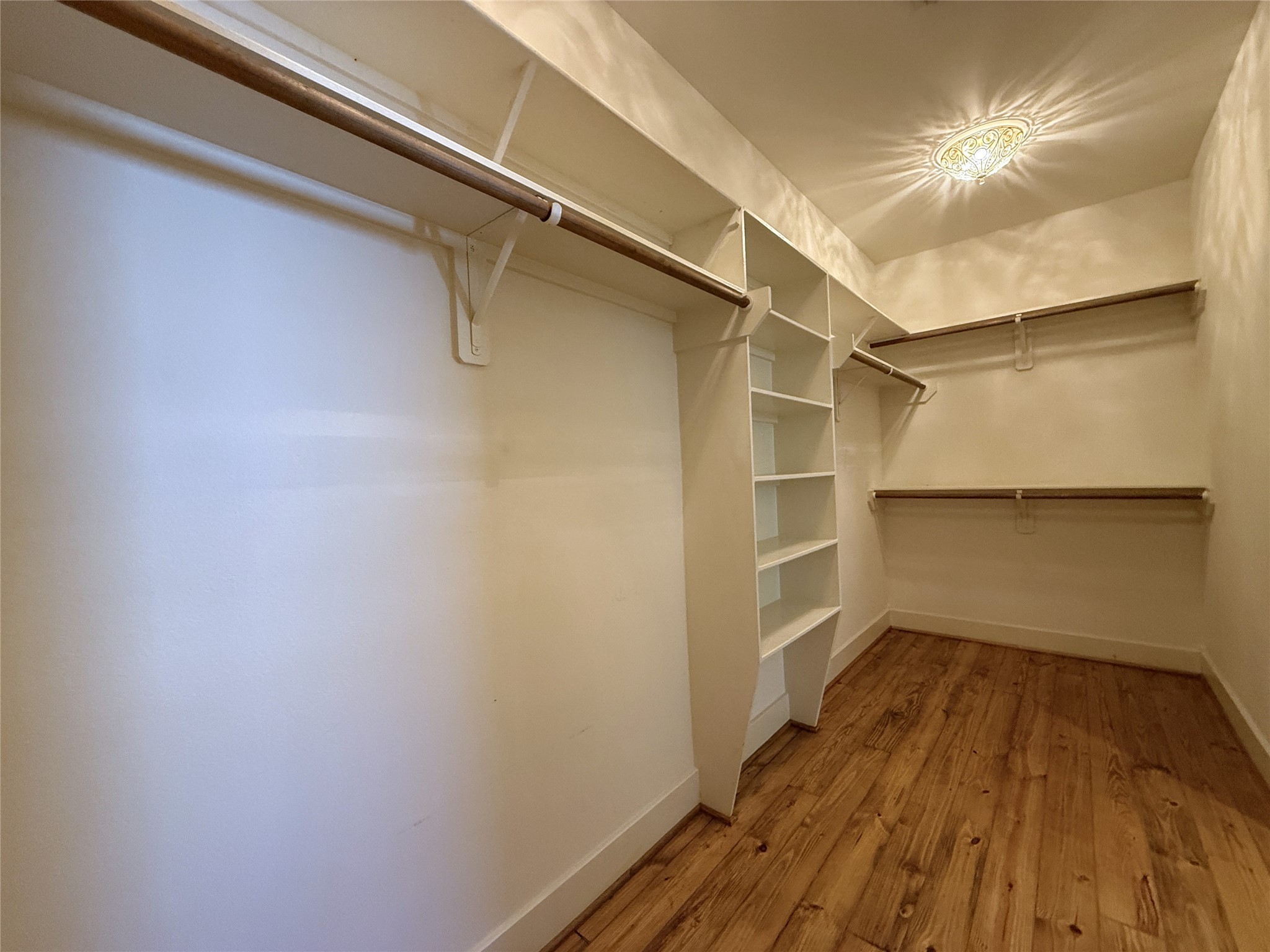 5237 Center Street Houston, TX 77007 - Photo 21 of 27 a view of a room with wooden floor and a window