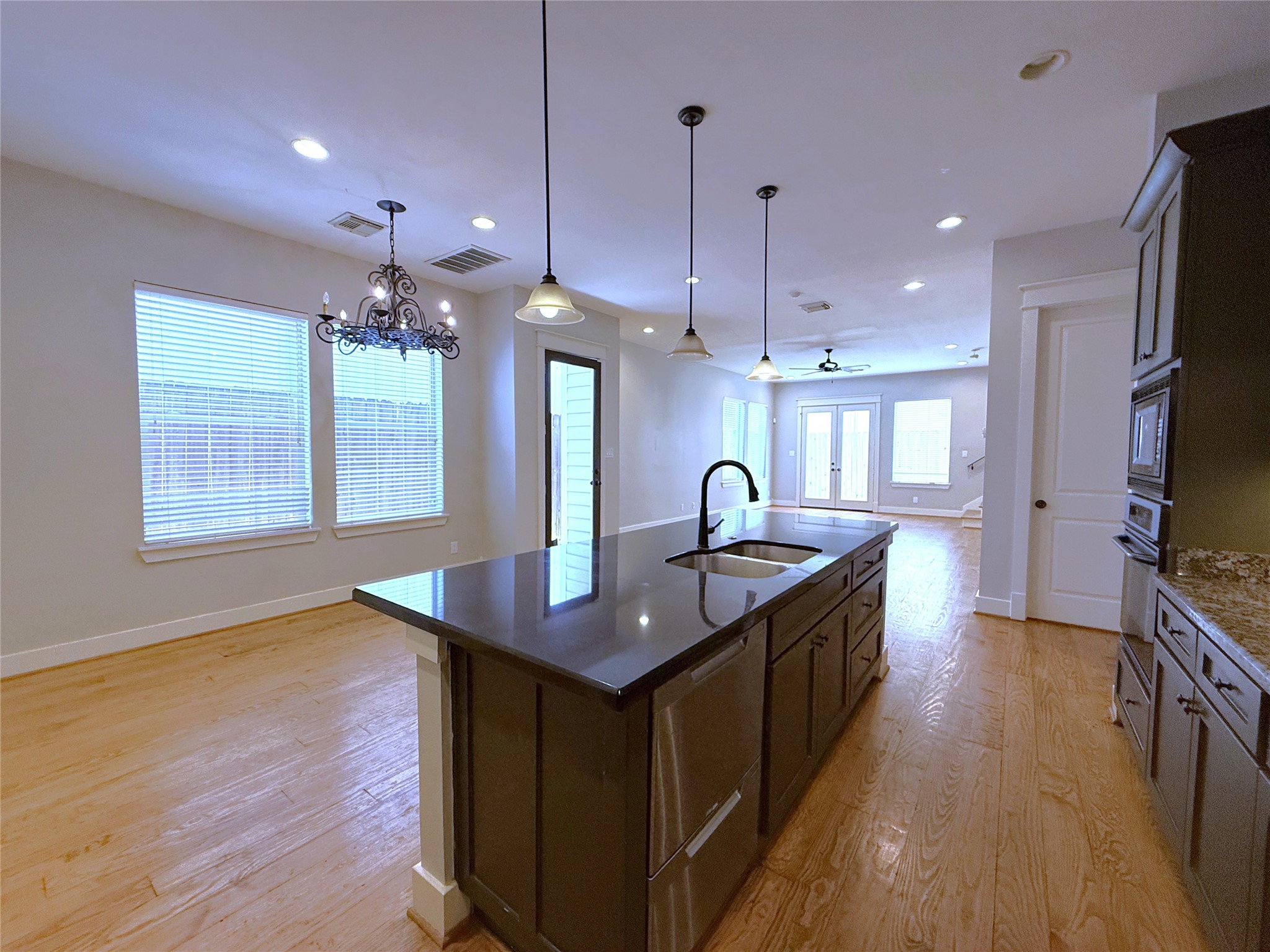 5237 Center Street Houston, TX 77007 - Photo 4 of 27 a kitchen that has a lot of cabinets and wooden floor