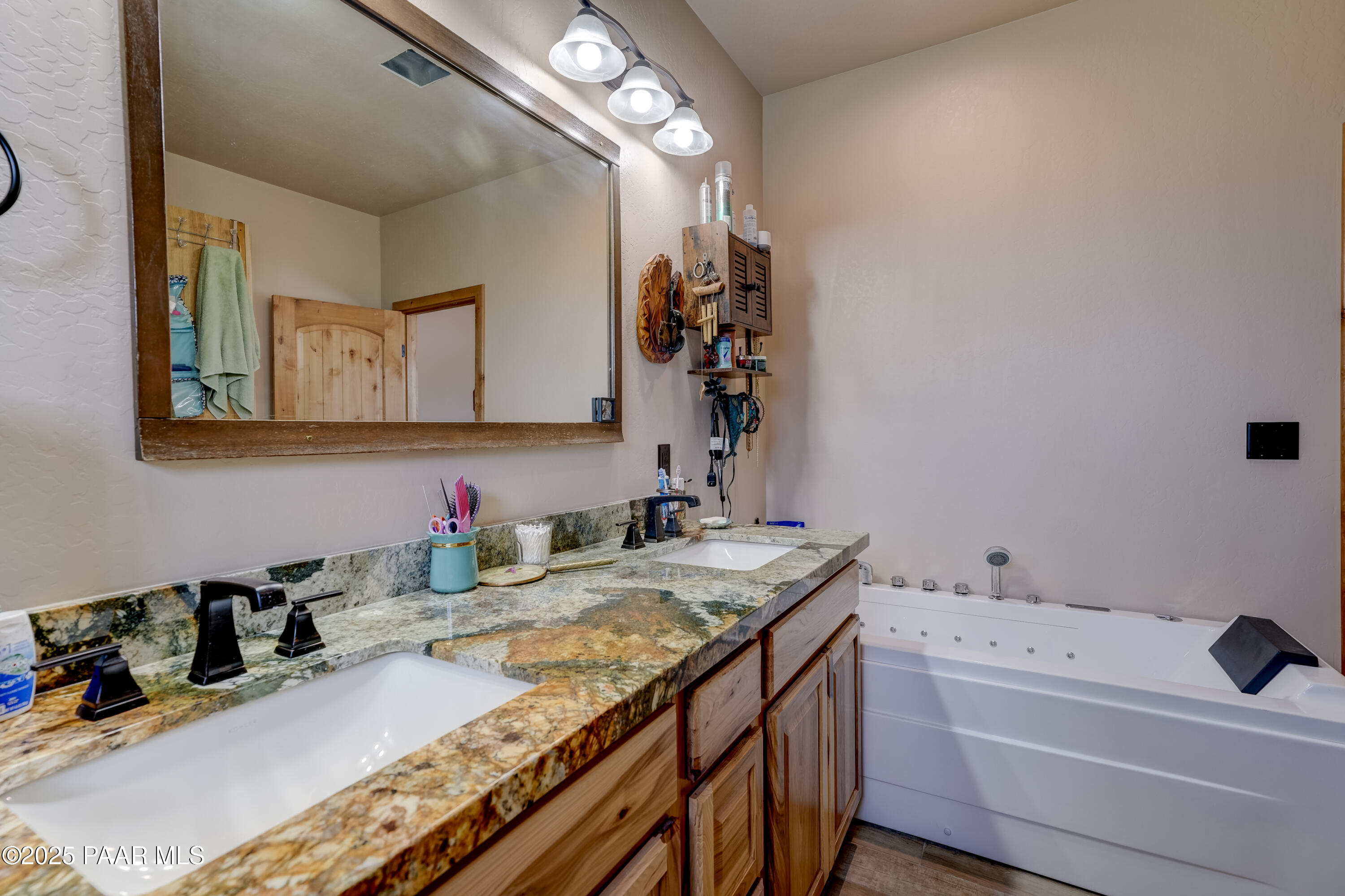 24720 North Rj Way Paulden, AZ 86334 - Photo 13 of 43 a bathroom with a granite countertop sink a large mirror and shower