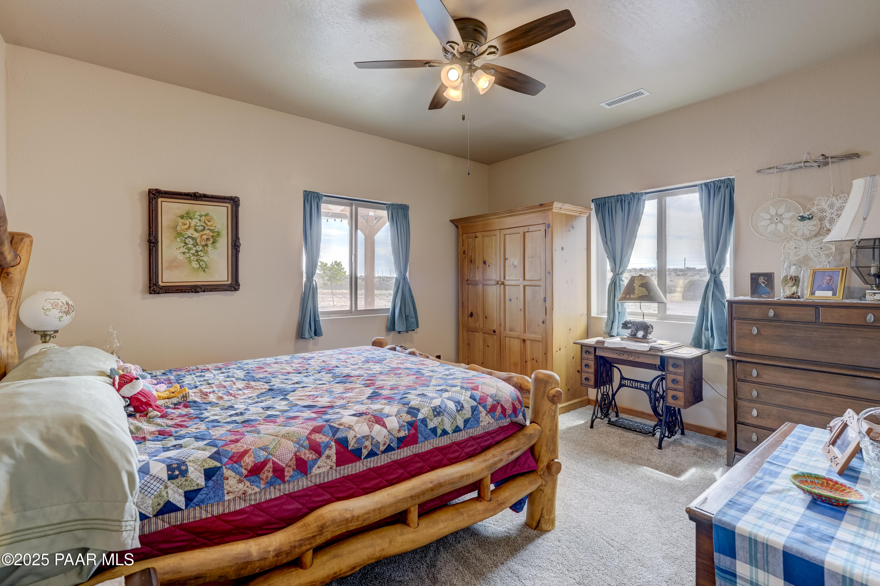 24720 North Rj Way Paulden, AZ 86334 - Photo 16 of 43 a bedroom that has a bed and a table in it