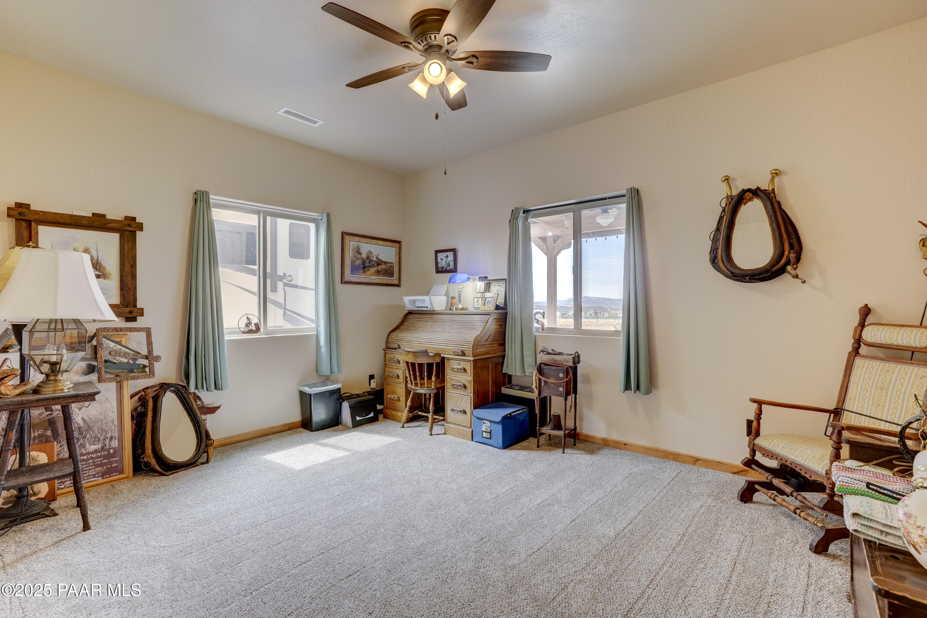 24720 North Rj Way Paulden, AZ 86334 - Photo 18 of 43 a living room with furniture a flat screen tv and a window