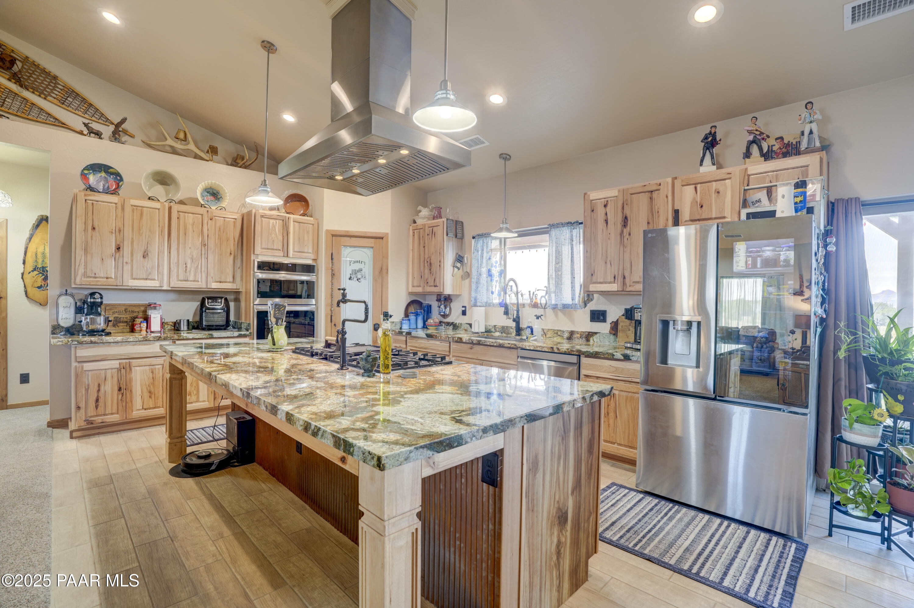 24720 North Rj Way Paulden, AZ 86334 - Photo 4 of 43 a kitchen with stainless steel appliances granite countertop a sink a stove and a refrigerator
