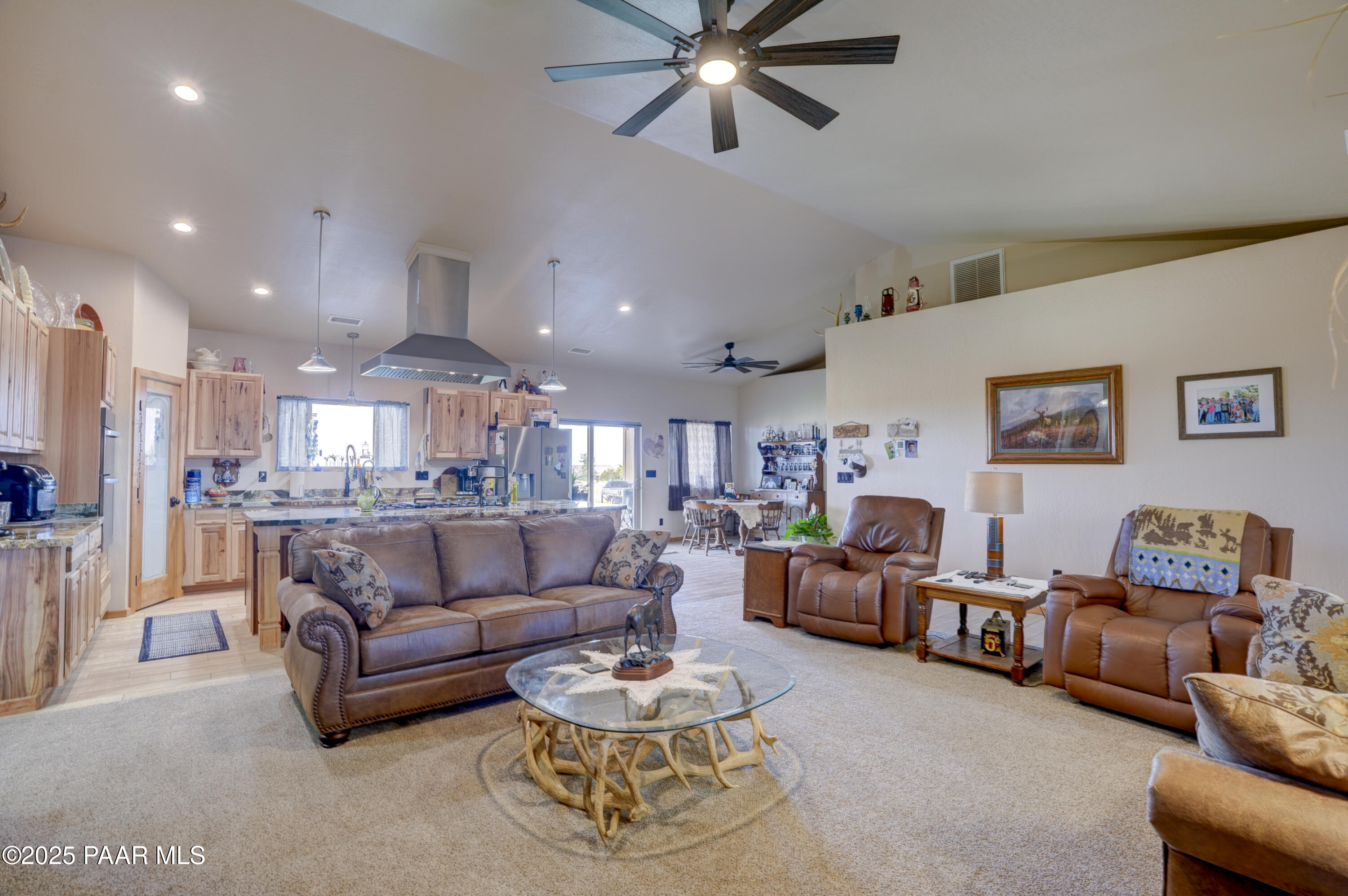 24720 North Rj Way Paulden, AZ 86334 - Photo 9 of 43 a living room with furniture and a view of kitchen