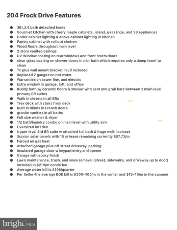 a kitchen with granite countertop cabinets a sink a stove a dining table and chairs