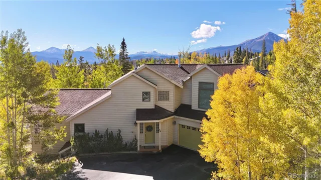 a view of a house with a yard and chandelier