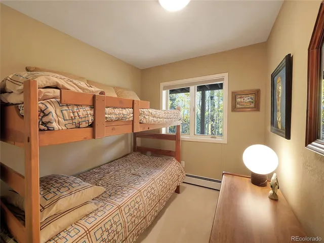 a spacious bedroom with a bed and window