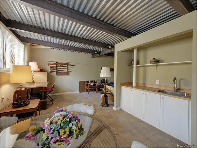 a view of a workspace with furniture