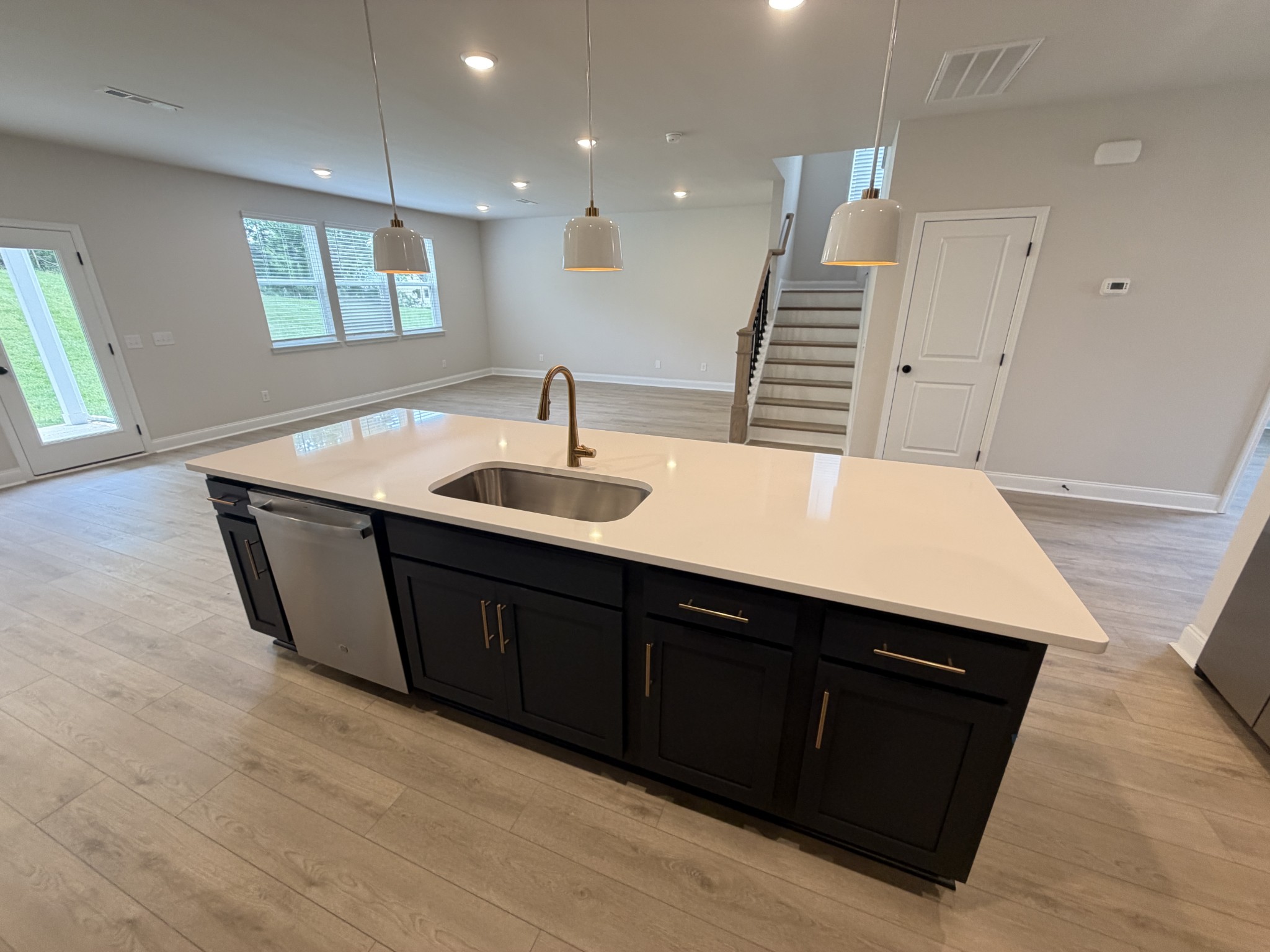 147 Emeline Way Mount Juliet, TN 37122 - Photo 11 of 41 a kitchen with center island wooden floor and stainless steel appliances