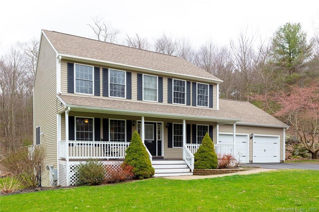 136 Bear Hill Road Killingly, CT 06241 - Photo 1 of 1 a front view of a house with a yard