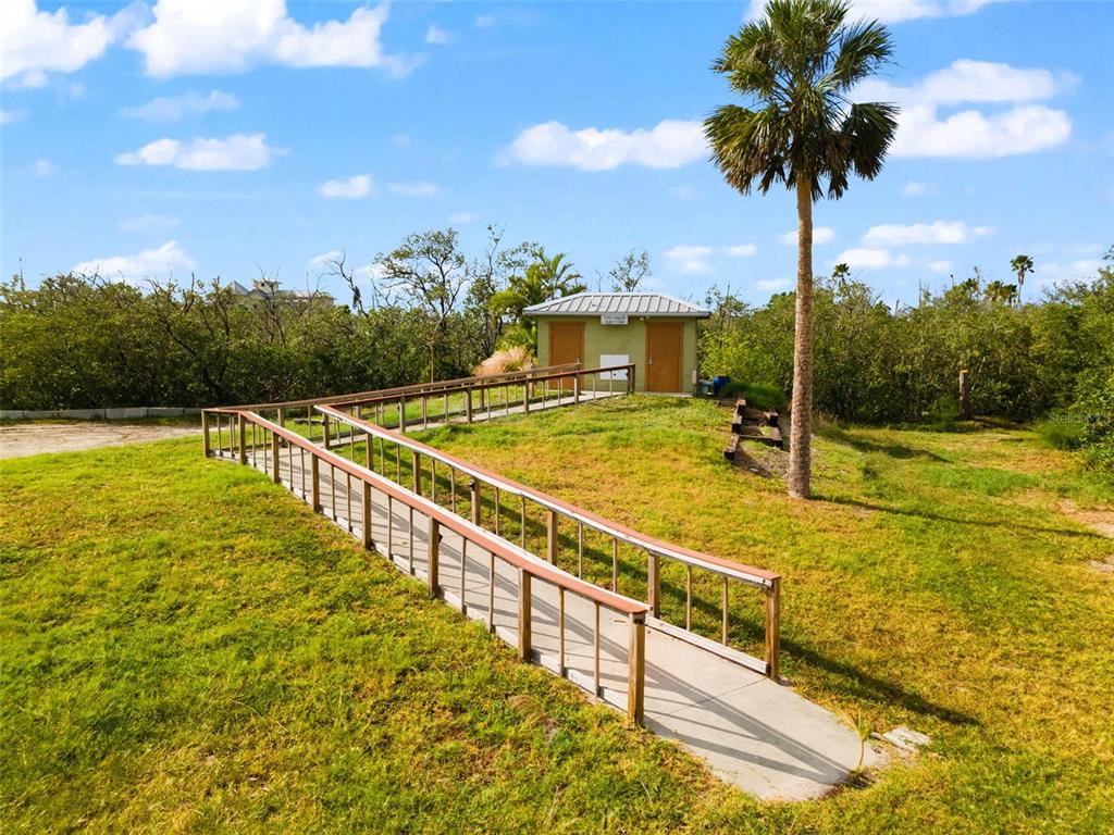 7325 Holly Road Terra Ceia, FL 34250 - Photo 85 of 87 a view of a swimming pool with a chair