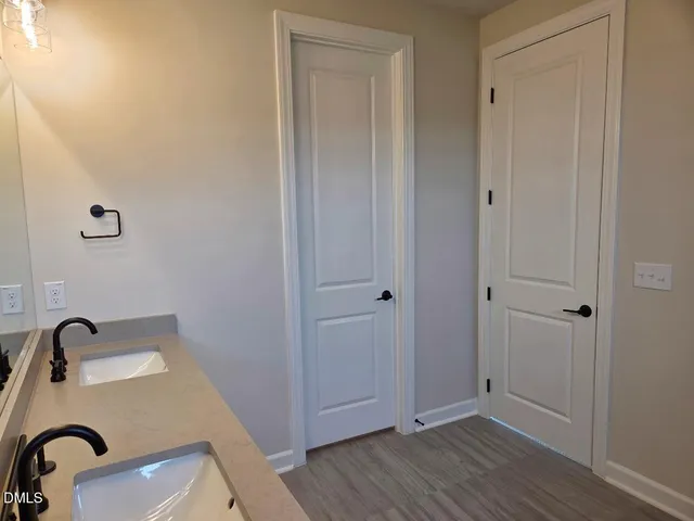 a bathroom with a sink and mirror