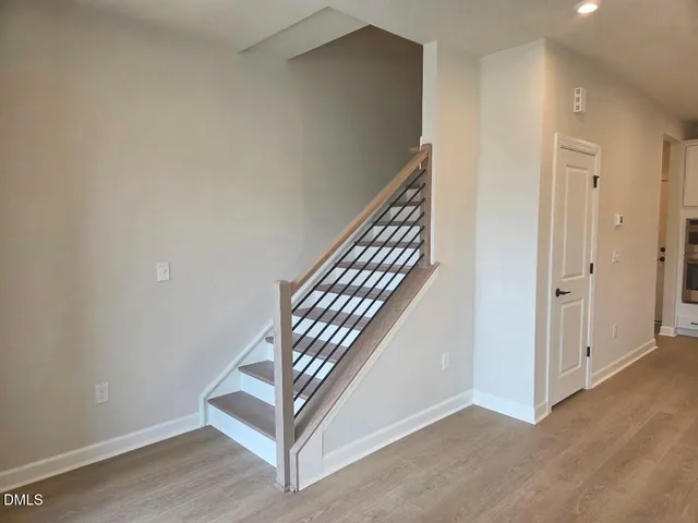 a view of a hallway with staircase
