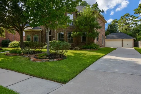 a view of a swimming pool with a patio and a yard