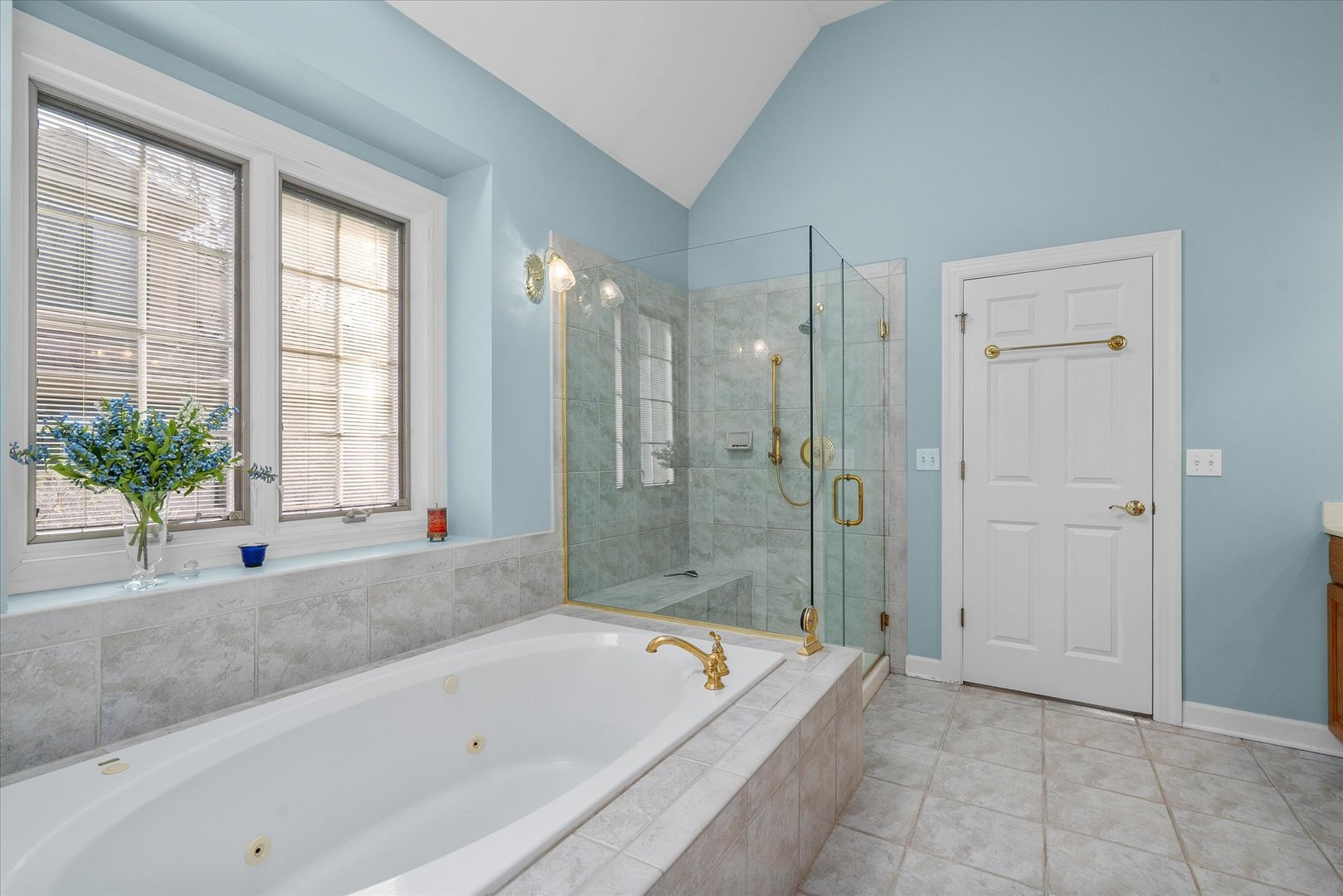 35 Walnut Circle Sugar Grove, IL 60554 - Photo 15 of 42 a bathroom with a tub shower and window