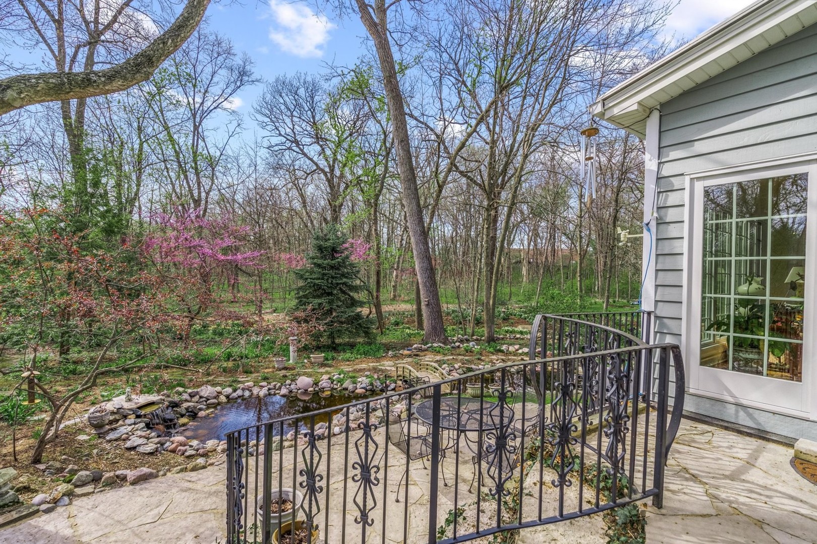 35 Walnut Circle Sugar Grove, IL 60554 - Photo 2 of 42 a view of a roof deck with two couches and wooden fence