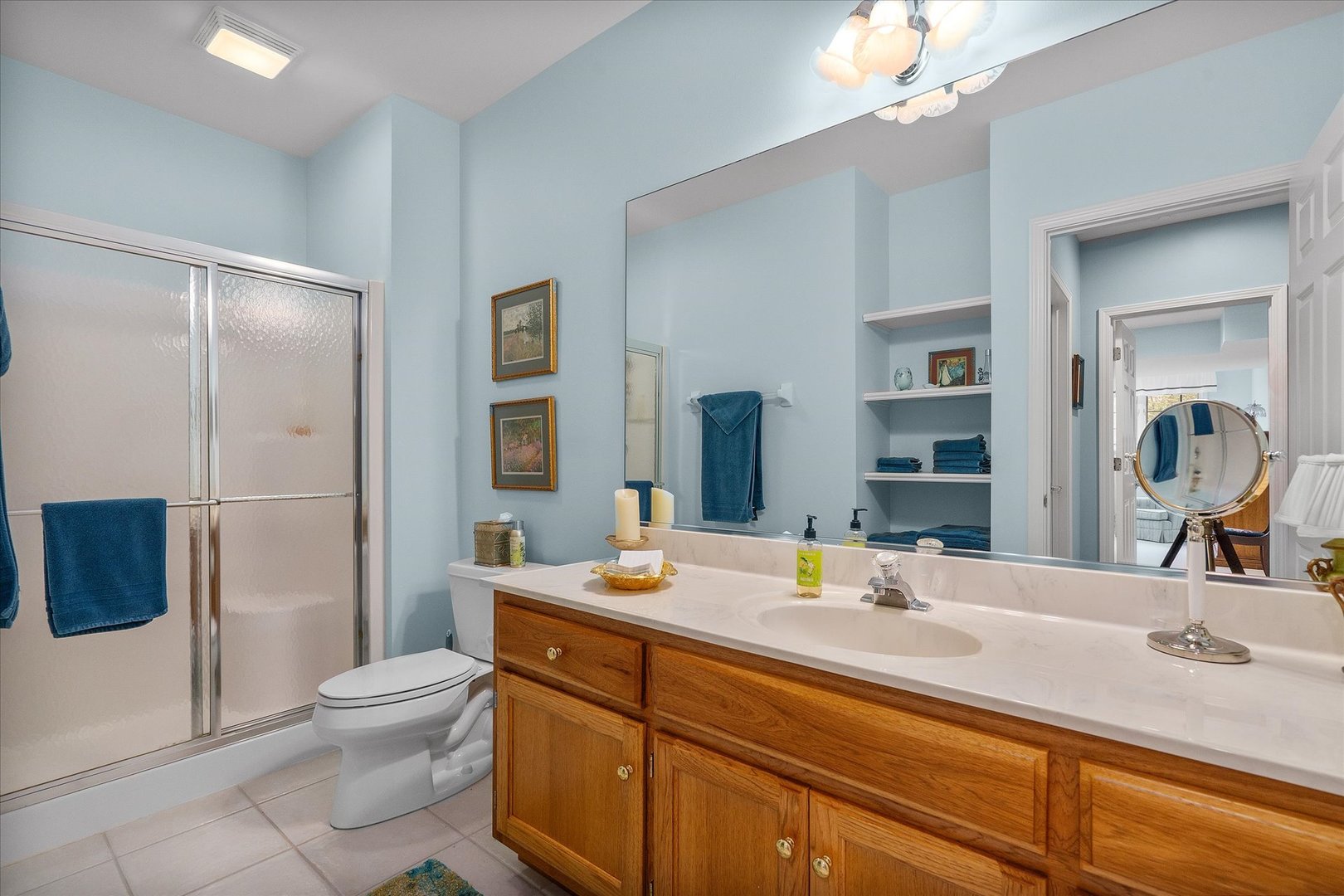 35 Walnut Circle Sugar Grove, IL 60554 - Photo 24 of 42 a bathroom with a sink a toilet a large mirror and shower