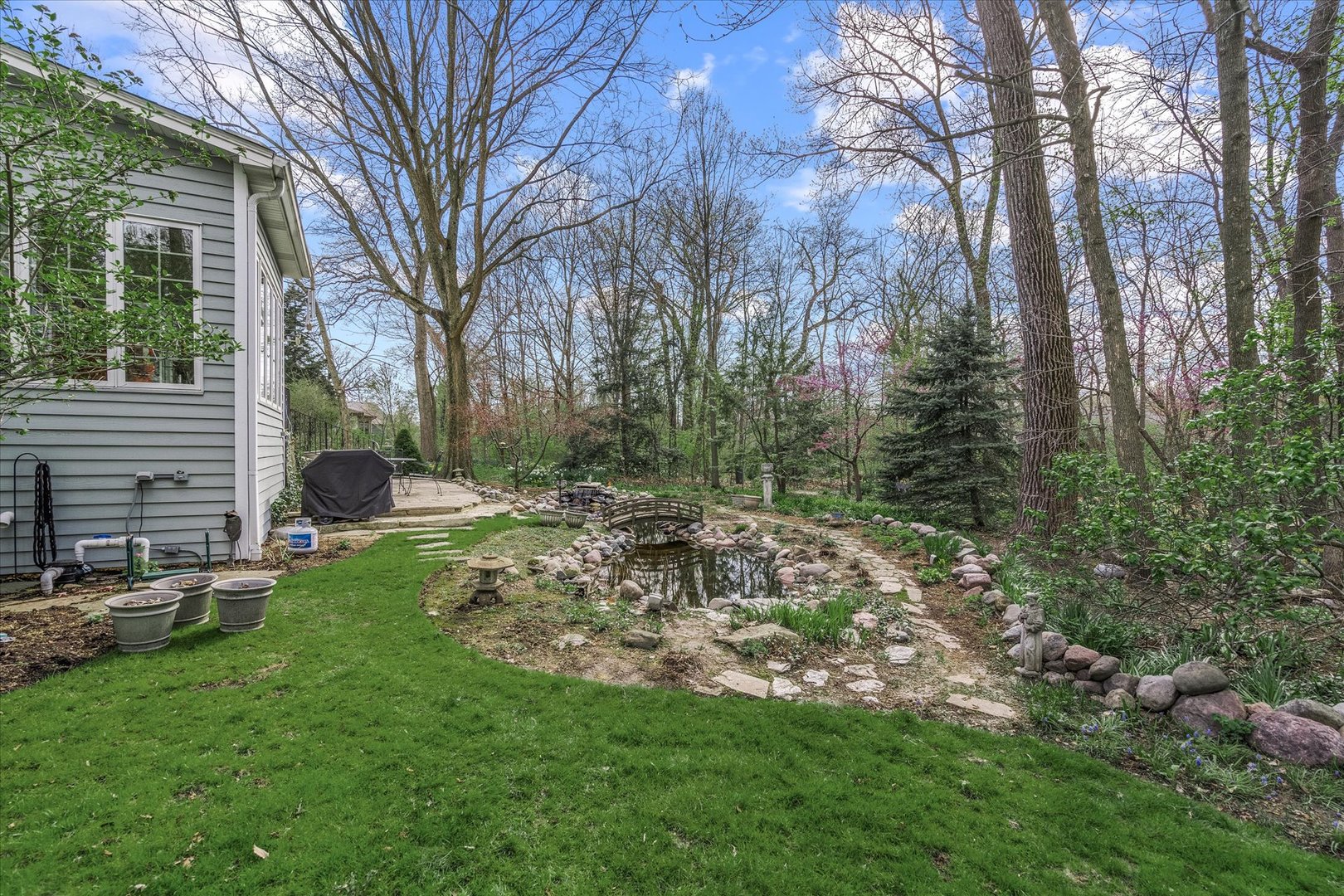 35 Walnut Circle Sugar Grove, IL 60554 - Photo 28 of 42 a view of a backyard with a garden and entertaining space