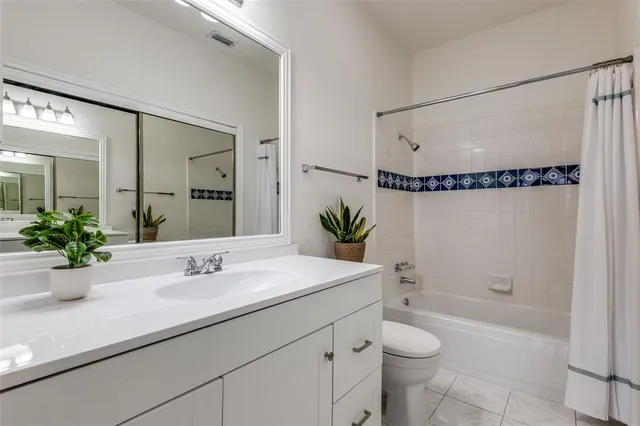 a view of a balcony with wooden floor