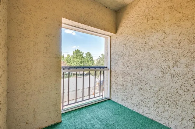 a view of a swimming pool with outdoor seating