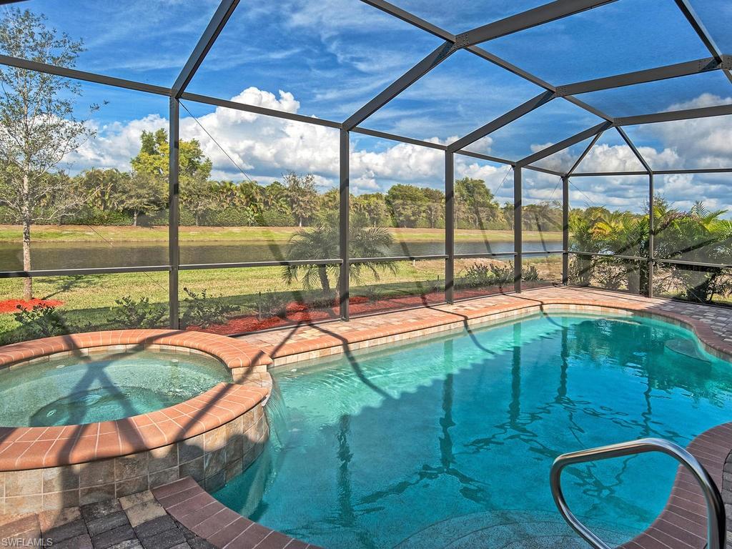 2850 Aviamar Circle Naples, FL 34114 - Photo 1 of 26 a view of a swimming pool with a patio