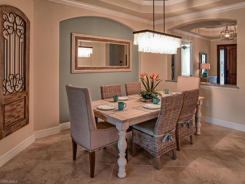 2850 Aviamar Circle Naples, FL 34114 - Photo 11 of 26 a dining room with furniture and window