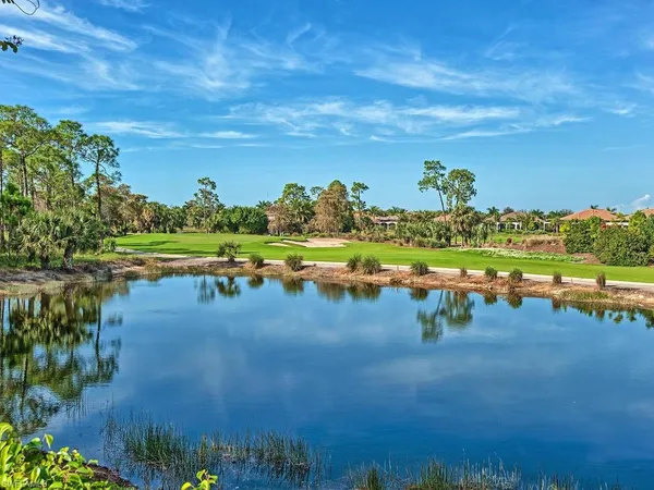 a view of a lake with a yard