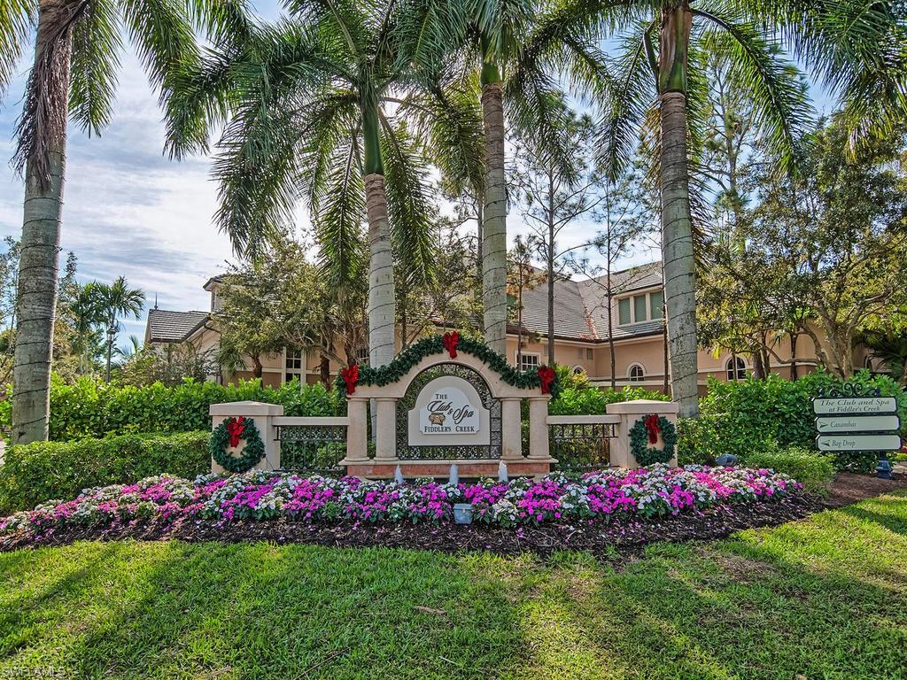 2850 Aviamar Circle Naples, FL 34114 - Photo 24 of 26 a view of house with swimming pool and garden