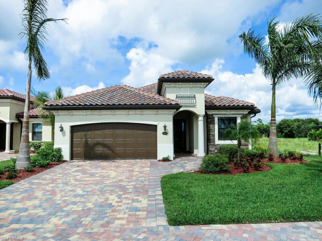 2850 Aviamar Circle Naples, FL 34114 - Photo 3 of 26 a front view of a house with a garden