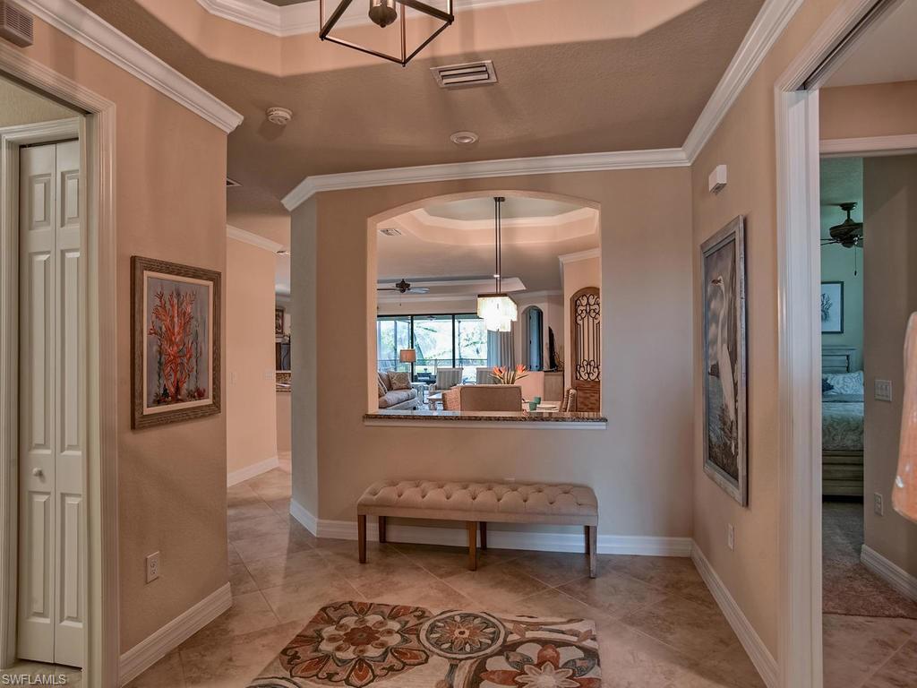 2850 Aviamar Circle Naples, FL 34114 - Photo 4 of 26 a bedroom with furniture and a window