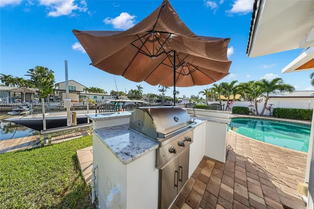 a view of a backyard with sitting area