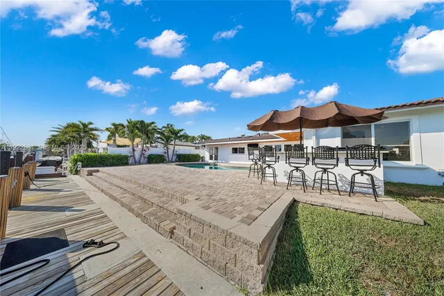 a view of a house with patio and dining area