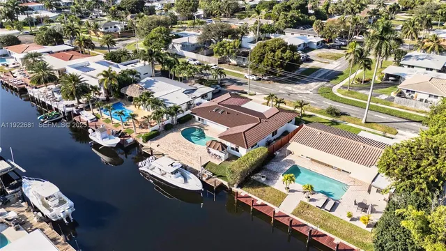 an aerial view of residential houses with outdoor space